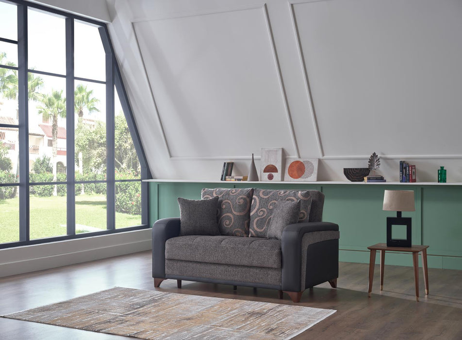 The Austin Armchair creates an inviting space with its plush seating and round arms.