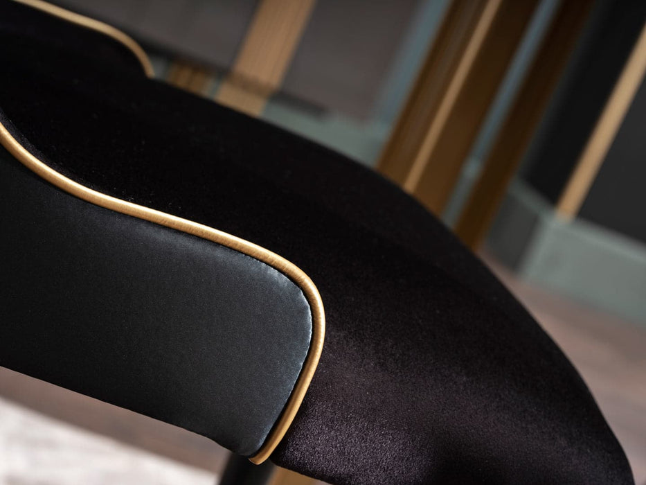 The Carlino Chair with a marble tempered finish, adding a touch of sophistication to any dining setting.