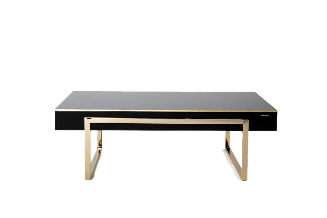 The Carlino Chrome Coffee Table featuring modern design aesthetics with golden metal legs.