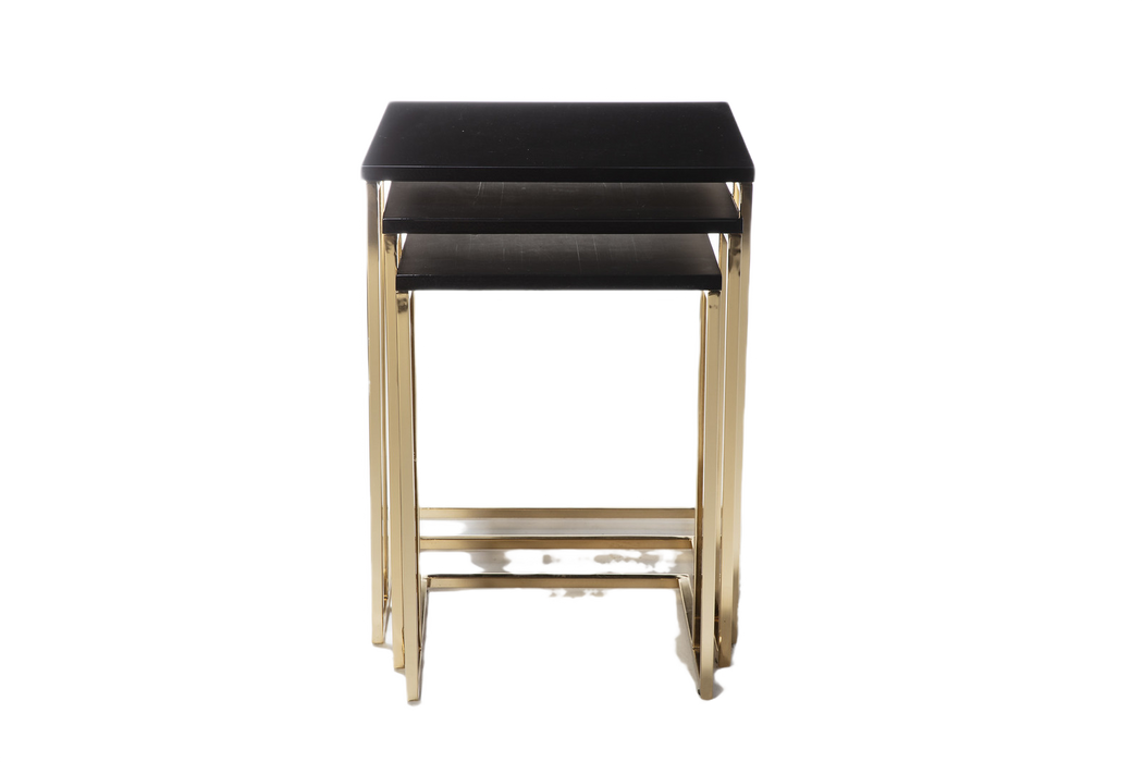 Elegant nesting table with a sleek black top and luxurious golden metal legs, ideal for any interior.
