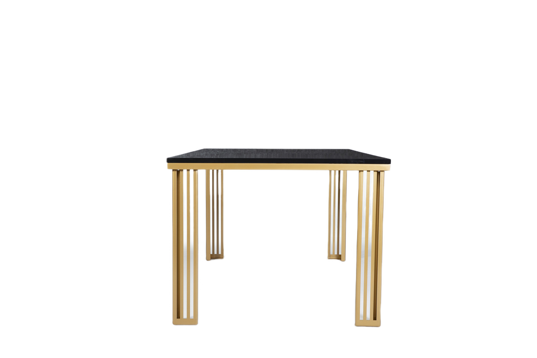 The Carlino Table as a centerpiece in a stylish dining room, featuring a marble tempered finish and gold accents.