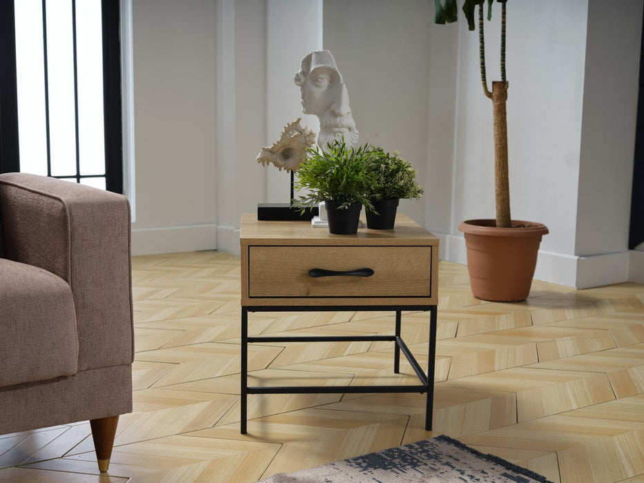 The Drift Side Tableâ€™s modern design and contrasting finishes add a stylish touch to any room.