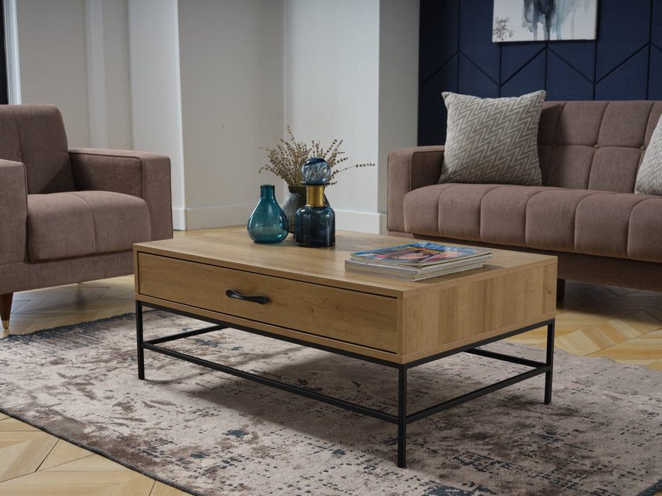 The Drift Coffee Tableâ€™s wrought iron legs provide a sharp contrast and industrial flair.