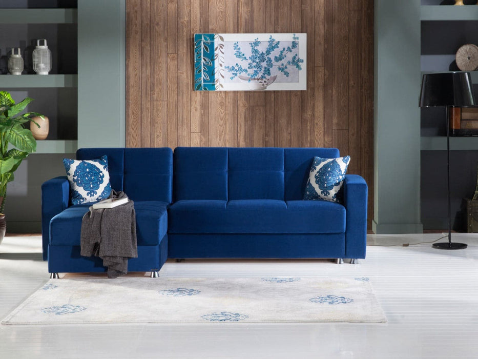 Add a touch of luxury to your living space with the Elegant Collectionâ€™s sectional in velvety royal blue performance fabric.