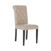 Modern James Dining Chair with sleek black legs and button tufting for an upscale dining experience.