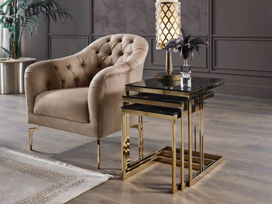 Montego Armchair with chic gold accents and a pull-out seat transforming into a daybed, blending retro and contemporary styles.