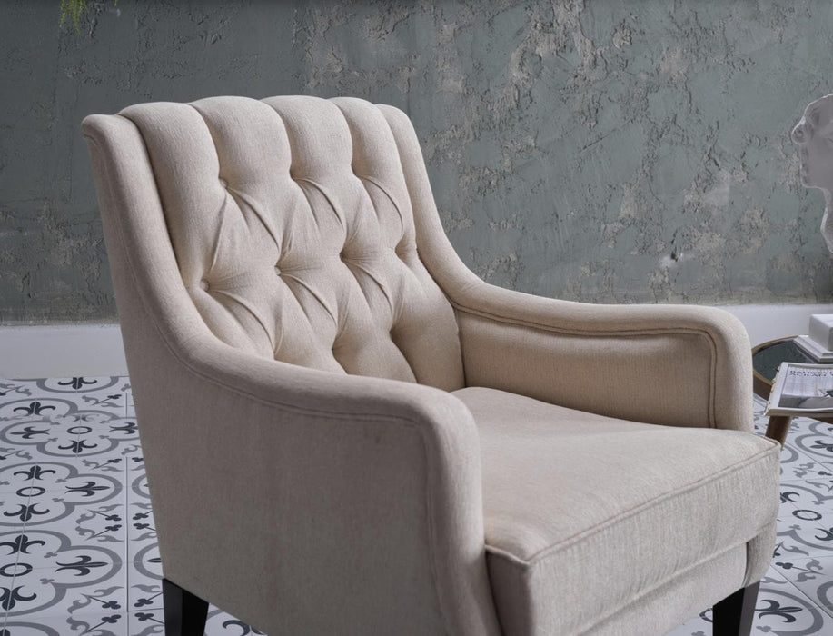 Refined and stylish Pearle Accent Chair with generous proportions and elevated button-tufting. Adds elegance and warmth to your living room or bedroom.